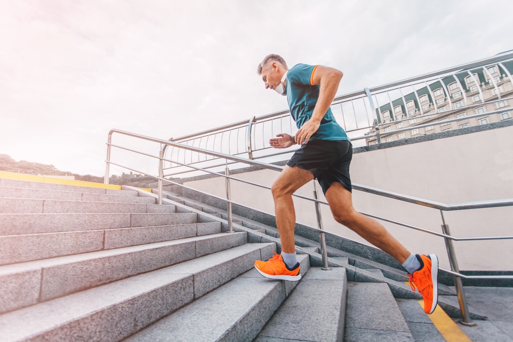 Healthy,Lifestyle,Middle,Aged,Man,Runner,Running,Upstairs,On,Cit