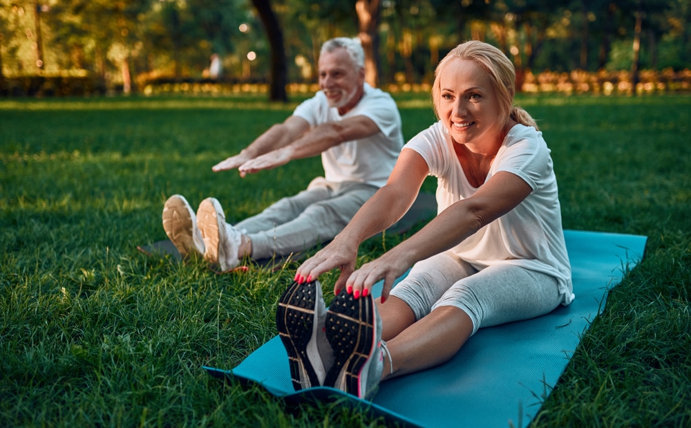Senior,Couple,Is,Doing,Sport,Outdoors.,Stretching,In,Park,During