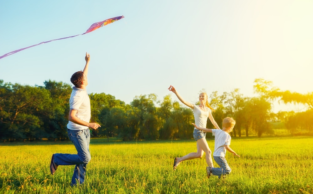Happy,Family,In,Summer,Nature.,Dad,,Mom,And,Son,Child